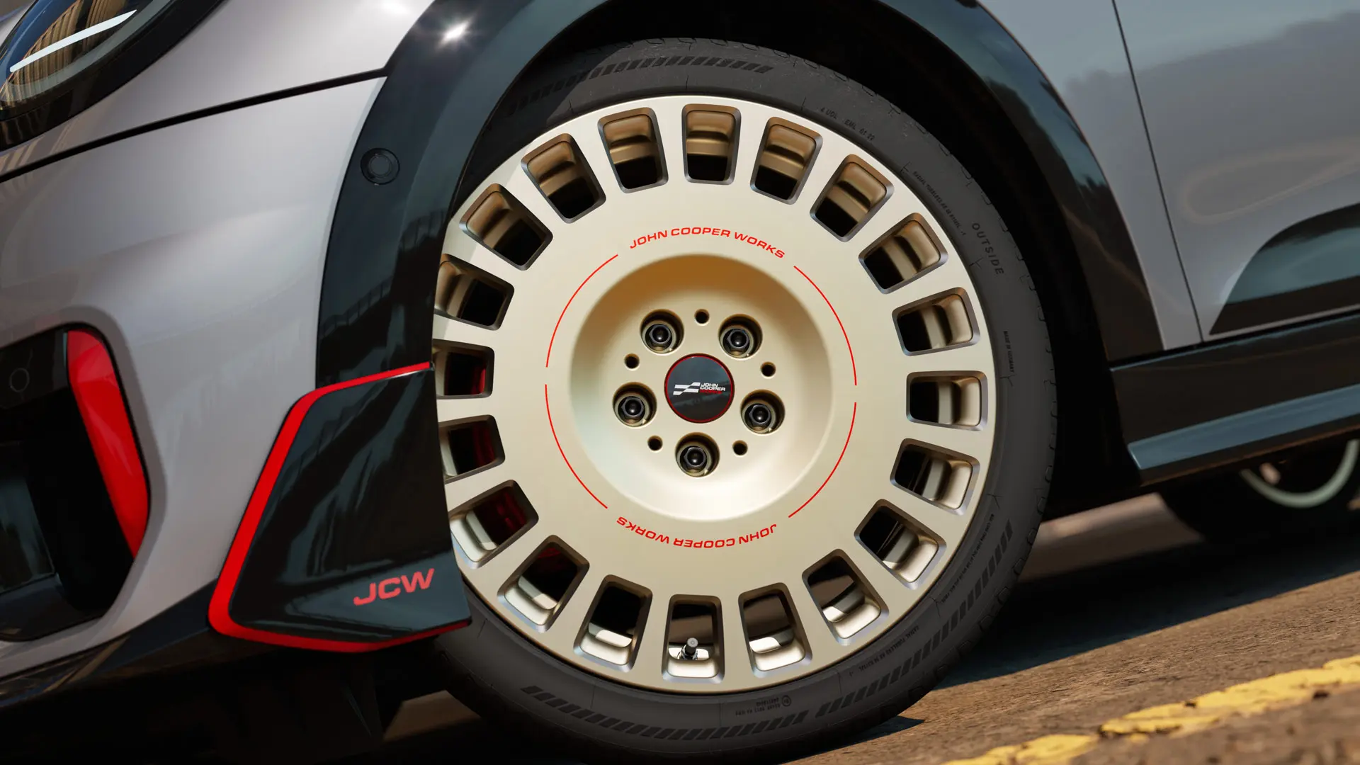 Zoom sui dettagli di un cerchio JCW Rallye Spoke 964 da 18" in Bicolour Vibrant Silver con finitura diamantata e winglet anteriore.