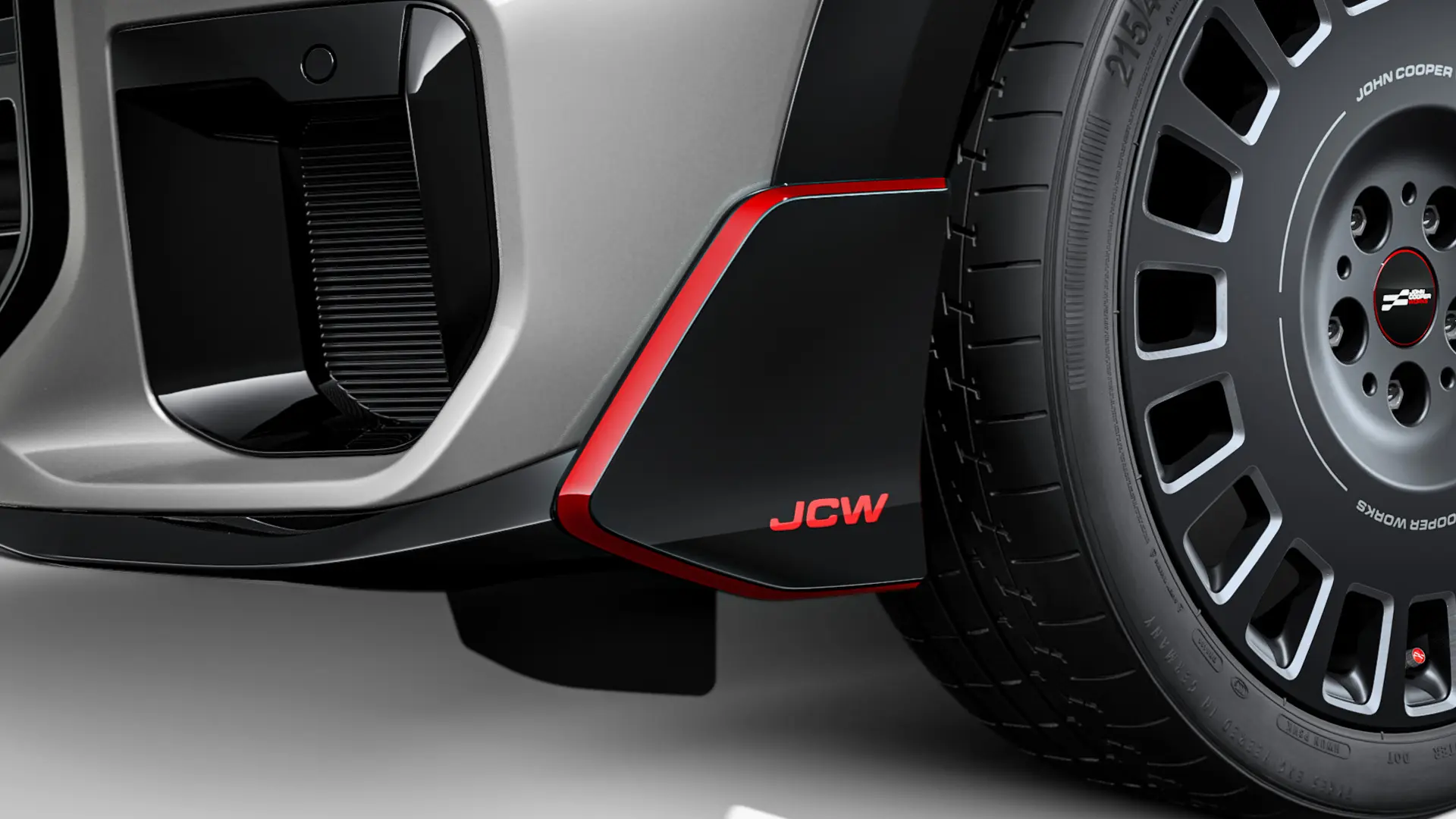 Aletta anteriore MINI John Cooper Works in Black pastello lucido con scritta JCW rossa e strisce adesive di contrasto.